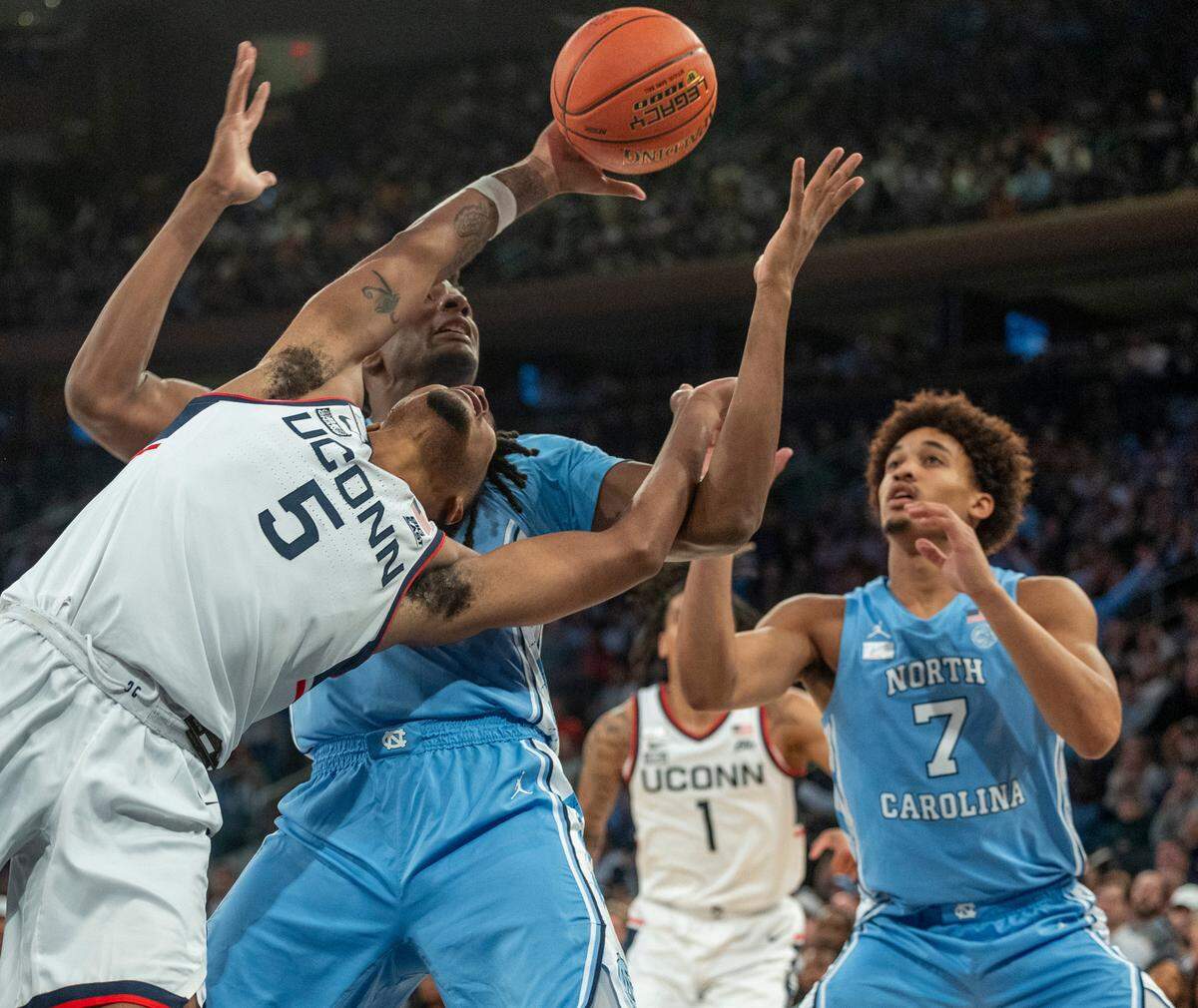North Carolina’s Jalen Washington (13) battles for a rebound with Connecticut’s Stephon Castle (5) during the first half in the Jimmy V Classic on Tuesday, December 5, 2023 at Madison Square Garden in New York, NY.
