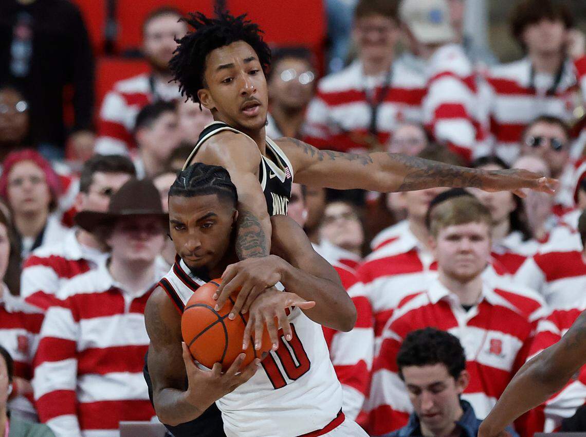 N.C. State’s Marcus Hill is fouled by Wake Forest’s Juke Harris late in the second half of the Wolfpack’s 85-73 win on Saturday, Feb. 22, 2025, at Lenovo Center in Raleigh, N.C.