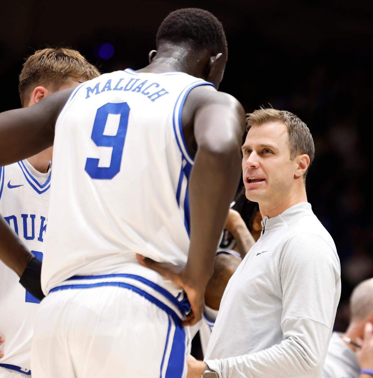 Duke’s head coach Jon Scheyer talks to Cooper Flagg (2) and Khaman Maluach (9) during a timeout in the second half of Duke’s 70-48 victory over Seattle at Cameron Indoor Stadium in Durham, N.C., Friday, Nov. 29, 2024.