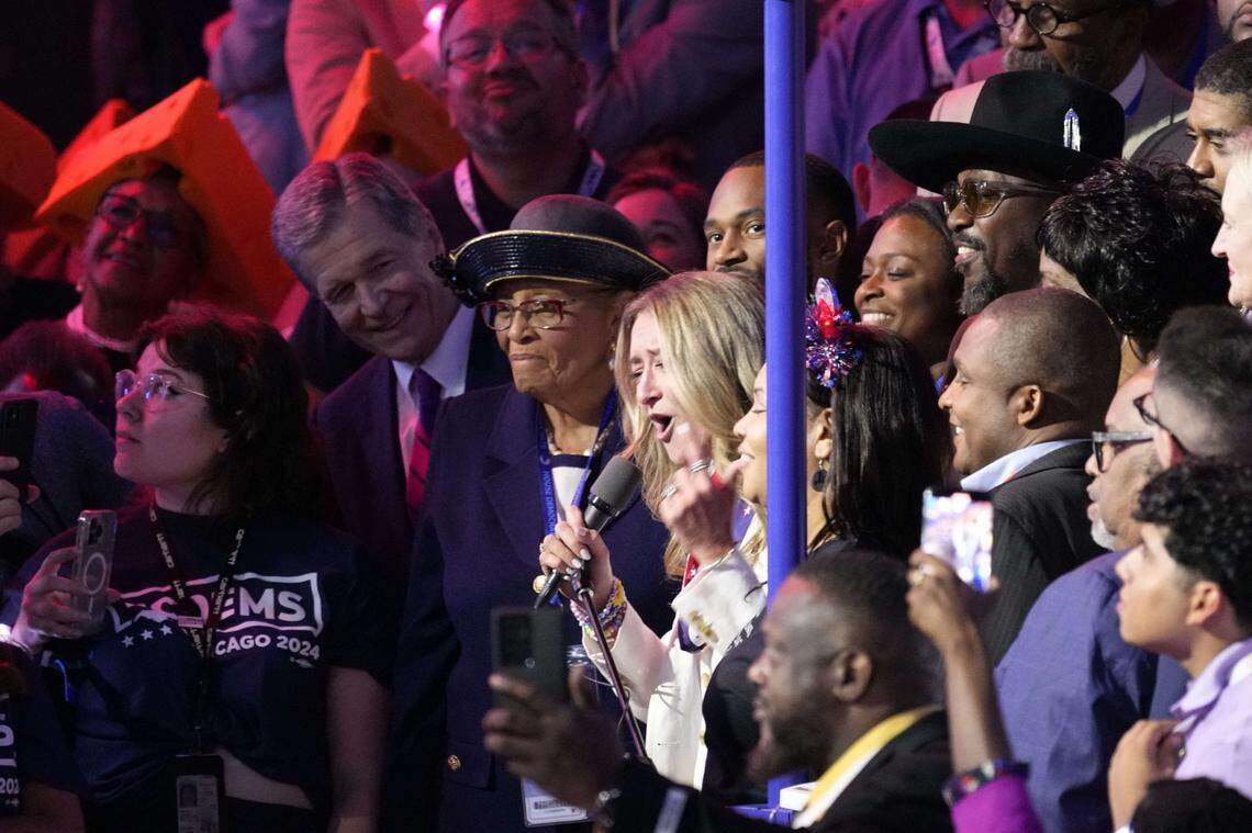 Aug 20, 2024; Chicago, IL, USA;  North Carolina Democratic Party chair Anderson Clayton joins state delegates to cast their votes in the ceremonial roll call  during the second day of the Democratic National Convention at the United Center.   Mandatory Credit: Jasper Colt-USA TODAY