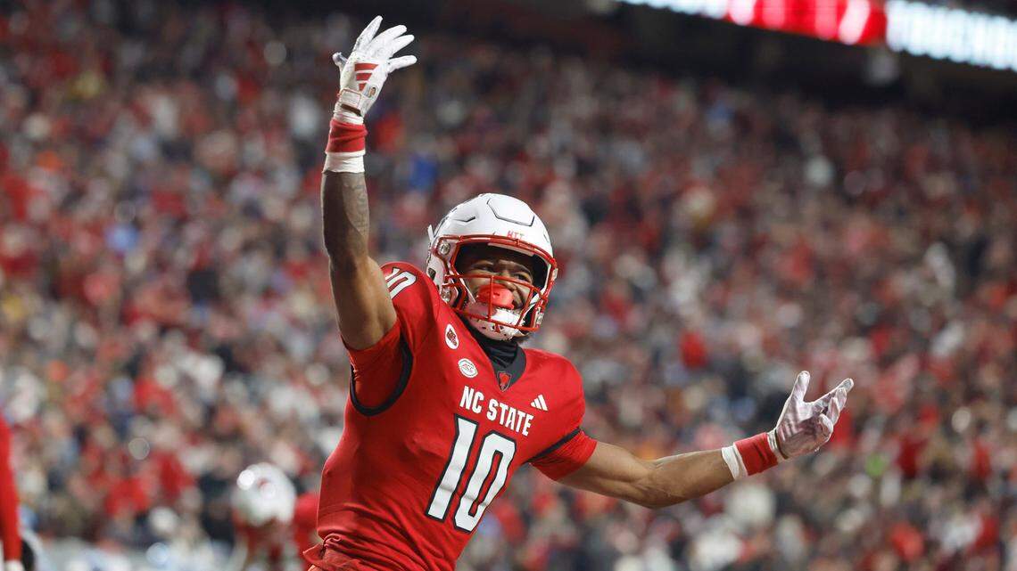 N.C. State wide receiver KC Concepcion (10) celebrates after scoring on a 11-yard touchdown reception during the first half of N.C. State’s game against UNC at Carter-Finley Stadium in Raleigh, N.C., Saturday, Nov. 25, 2023.