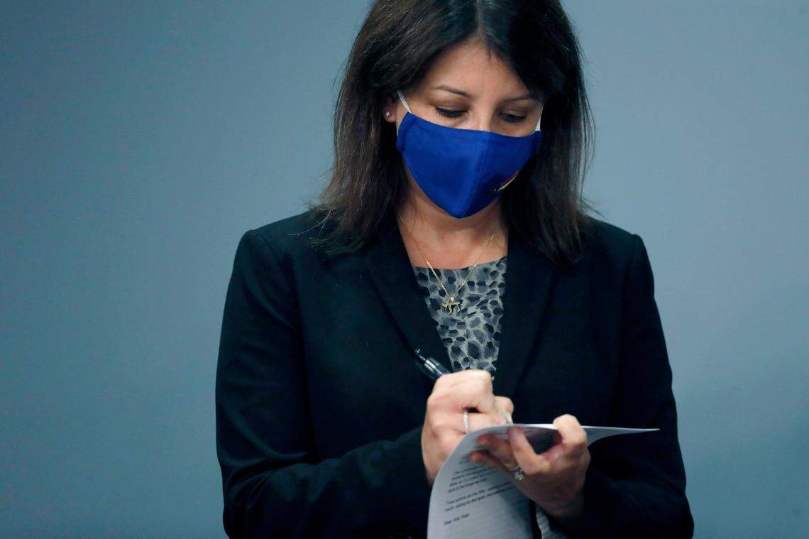 Dr. Mandy Cohen, Secretary of the N.C. Department of Health and Human Services, takes notes for a question during a briefing at the Emergency Operations Center in Raleigh, N.C., Tuesday, Sept. 1, 2020.
