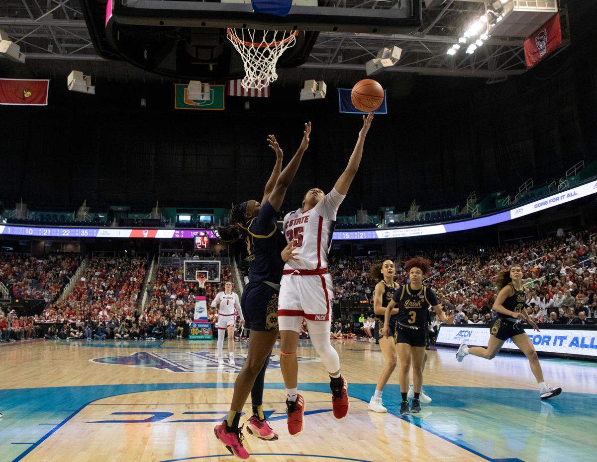 N.C. State’s Zoe Brooks drives to the basket past Notre Dame’s KK Bransford during the first half of the Wolfpack’s 55-51 loss in the ACC Tournament final on Sunday, March 10, 2024, at Greensboro Coliseum in Greensboro, N.C.