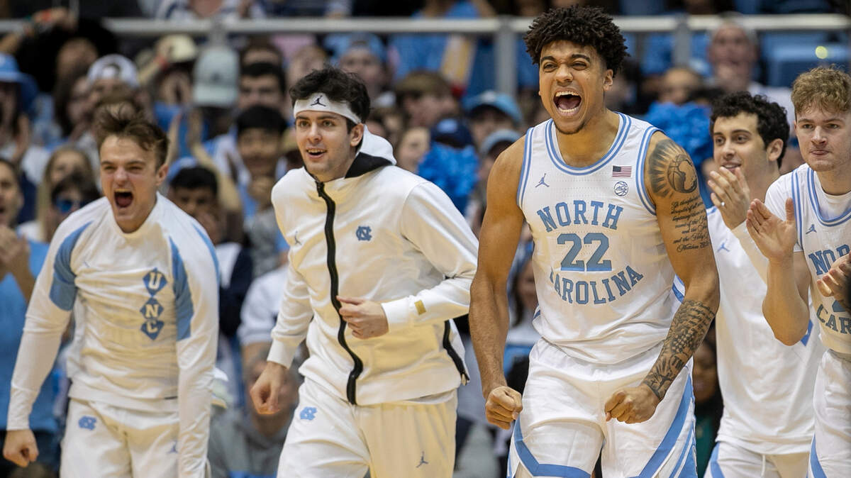 North Carolina’s Justin McKoy (22) leads the celebration off the bench after the Tar Heels’ took an early lead over Notre Dame in the first half on Saturday, January 7, 2023 at the Smith Center in Chapel Hill, N.C.