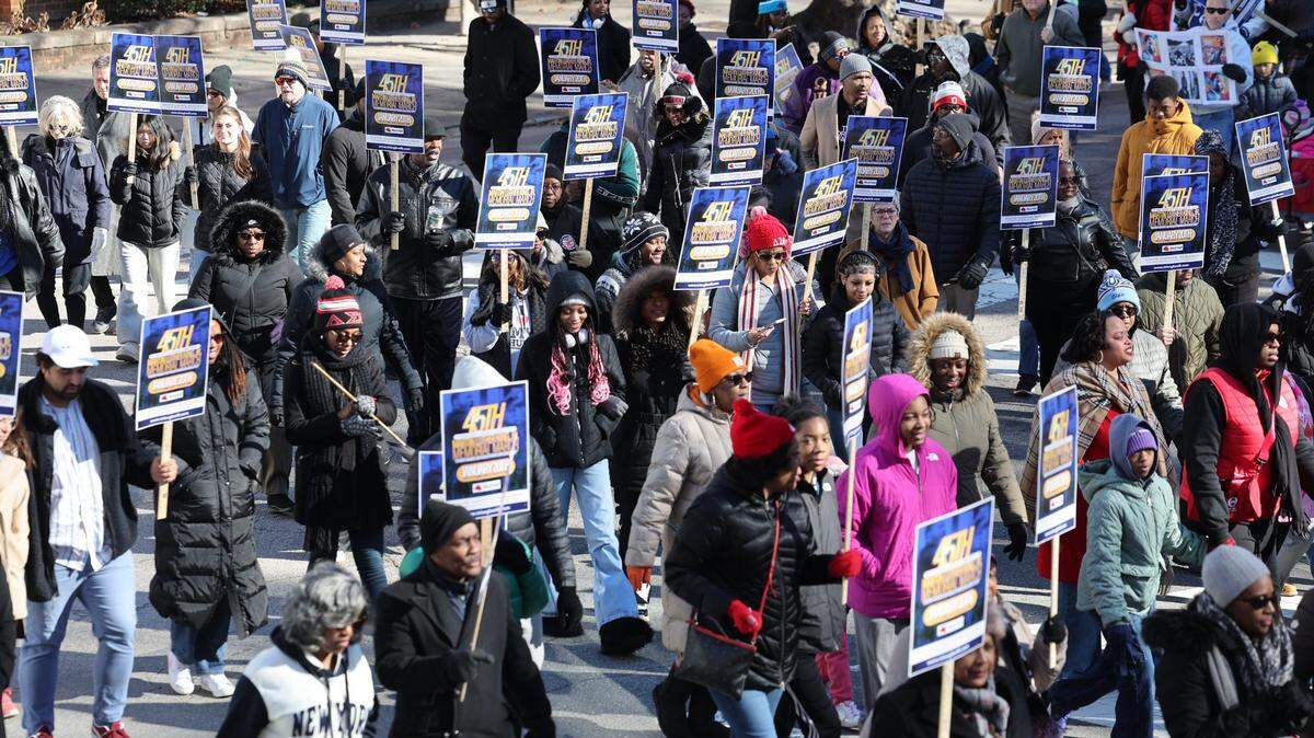 Parade-goers march during the 45th Annual Martin Luther King, Jr. Memorial March in downtown Raleigh on Monday, Jan. 20 ,2025.