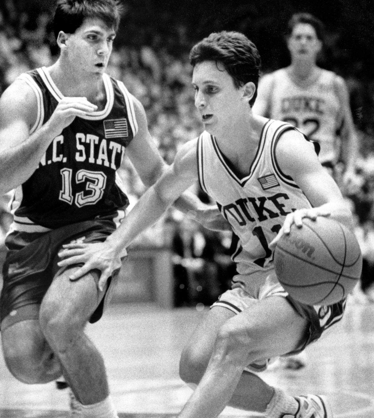 Duke’s Bobby Hurley drives against NC State’s Chris Corchiani during a game in 1991.