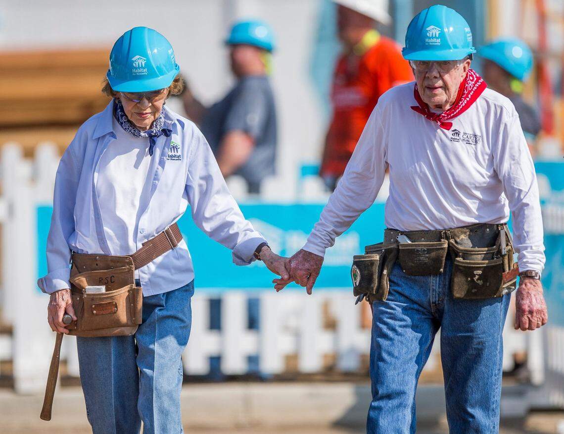 8/28/2018: Tribune Photo/ROBERT FRANKLINFormer President Jimmy Carter holds hands his wife and former first lady Rosalynn Carter while working with other volunteers on site during the first day of the weeklong Jimmy & Rosalynn Carter Work Project on Monday in Mishawaka. Former President Jimmy Carter holds hands his wife and former First Lady Rosalynn Carter while working with other volunteers on site during the first day of the weeklong Jimmy & Rosalynn Carter Work Project on Monday, Aug. 27, 2018, in Mishawaka.Jimmy Carter In Michiana