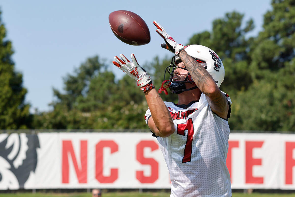 N.C. State wide receiver Anthony Smith (7) pulls in pas during the Wolfpack’s first practice of fall camp in Raleigh, N.C., Wednesday, August 3, 2022.