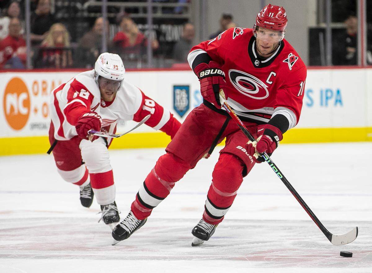 Carolina Hurricanes’ Jordan Staal (11) controls the puck ahead of Detroit’s Andrew Copp (18) in the first period on Tuesday, April 11, 2023 at PNC Arena in Raleigh, N.C.