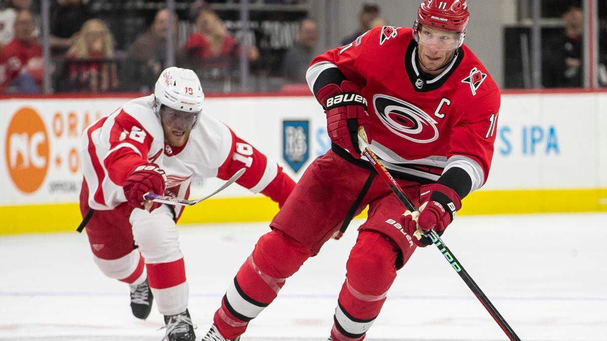 Carolina Hurricanes’ Jordan Staal (11) controls the puck ahead of Detroit’s Andrew Copp (18) in the first period on Tuesday, April 11, 2023 at PNC Arena in Raleigh, N.C.