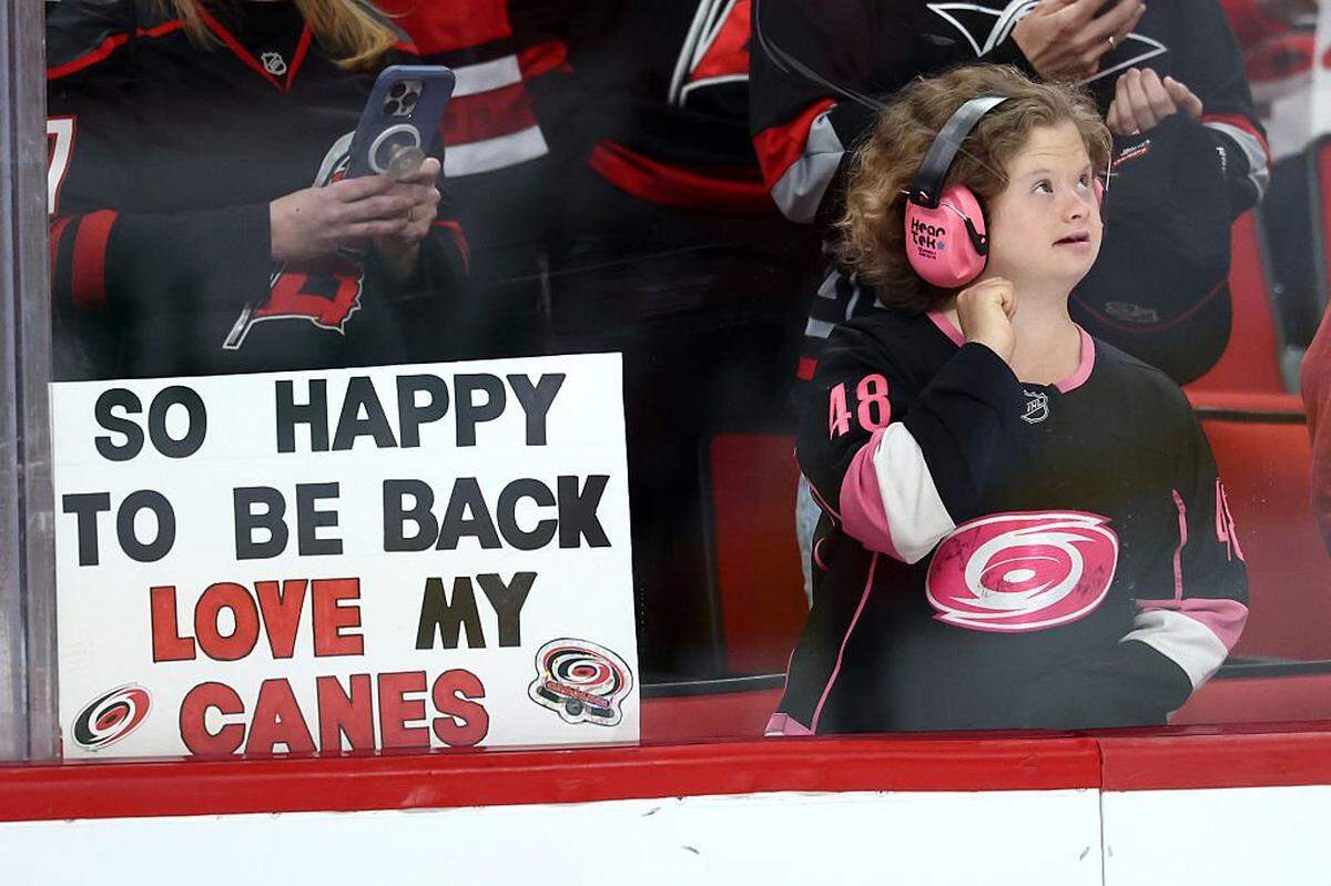 A Carolina Hurricanes fan looks on prior to the game between the Carolina Hurricanes and the New Jersey Devils at Lenovo Center on October 09, 2025 in Raleigh, North Carolina.