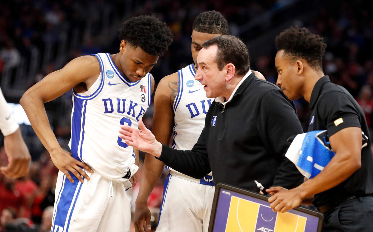 Duke head coach Mike Krzyzewski talks with his team, including Duke’s Jeremy Roach (3) and Trevor Keels (1) during the second half of Duke’s 78-69 victory over Arkansas in the NCAA Tournament West Regional finals at the Chase Center in San Francisco, Calif., Saturday, March 26, 2022.