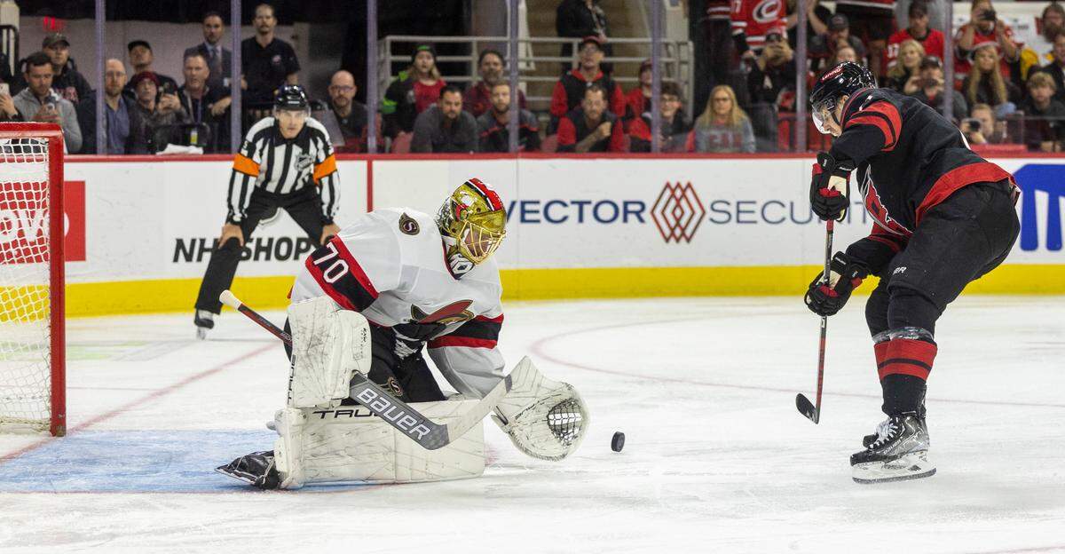 The Carolina Hurricanes Jesper Fast (71) takes a penally shot on the Ottawa Senators goalie Joonas Korpisalo (70) in the first period on Wednesday, October 11, 2023 at PNC Arena, in Raleigh N.C.