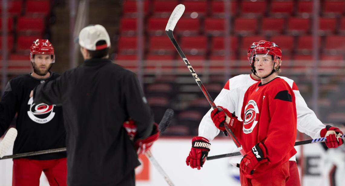 Carolina Hurricanes right wing Jackson Blake (53) listens to coach Rod Brind’Amour as they prepare for their Stanley Cup series against the Washington Capitals on Friday, May 2, 2025 at Lenovo Center in Raleigh, N.C.