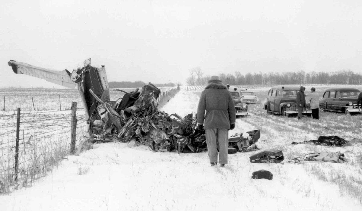 Officials survey the wreckage, Feb. 3, 1959, of a plane that was carrying musicians Buddy Holly, Ritchie Valens, J.P. “Big Bopper” Richardson and pilot Roger Peterson. The crash killed all on board. Hundreds of people from around the world still make the pilgrimage each year to the site of the crash near Clear Lake, Iowa. Holly is the subject of a film, “Clear Lake,” that’s in development.  Much of “Clear Lake” will be set during a 1958 “Biggest Show of Stars” tour that Holly did with Clarence Collins, founder of the seminal 1950s-vintage soul group Little Anthony and the Imperials.