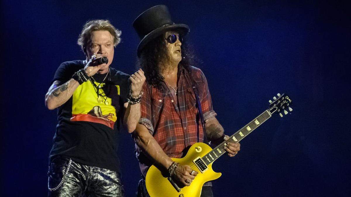 GLASTONBURY, ENGLAND - JUNE 24: Axl Rose (L) and Slash of Guns 'n' Roses perform on the Pyramid Stage on Day 4 of Glastonbury Festival 2023 on June 24, 2023 in Glastonbury, England. The Glastonbury Festival of Performing Arts sees musicians, performers and artists come together for three days of live entertainment. (Photo by Leon Neal/Getty Images)