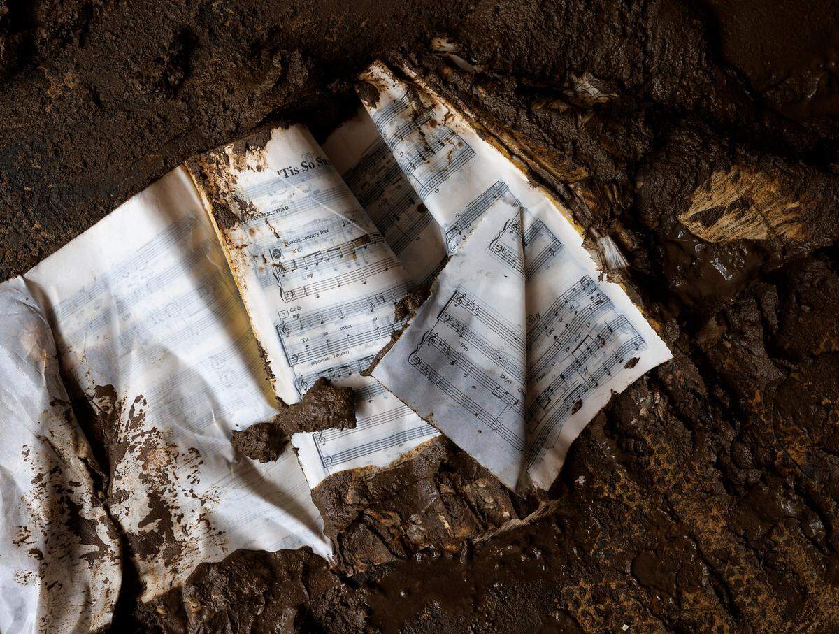 Sheet music sits on a mud-caked floor inside Majestic Music in downtown Spruce Pine, N.C. on Thursday, Oct. 3, 2024, days after Hurricane Helene brought heavy flooding to the area.