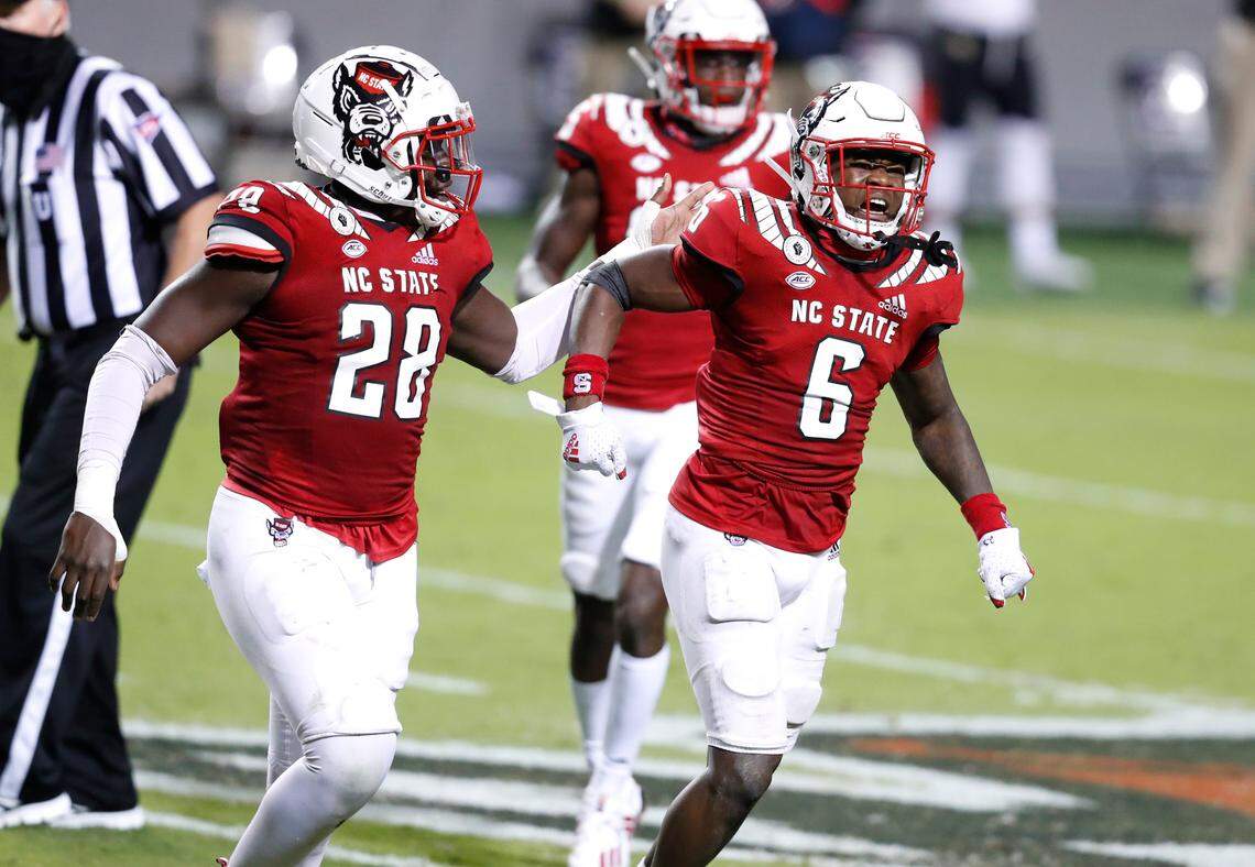 N.C. State safety Jakeen Harris (6) and Ibrahim Kante (28) celebrate after Harris broke up a pass intended for Wake Forest wide receiver A.T. Perry during the second half of N.C. State’s 45-42 victory over Wake Forest at Carter-Finley Stadium in Raleigh, N.C, Saturday, Sept. 19, 2020.