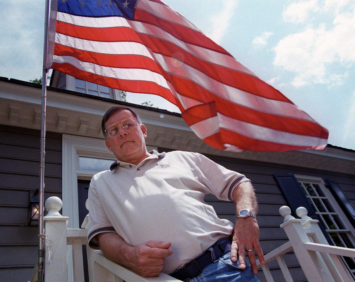 Al Martin, Cary, flies the American flag in front of his home in Williamsburg Commons. Martin was told by Williamsburg Commons that it was not permissible to fly the flag in the front of his home where it is currently displayed.