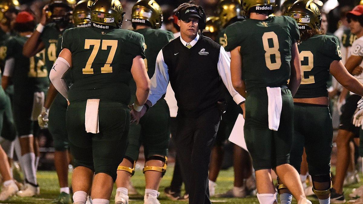 Cardinal Gibbons head coach Steven Wright congratulates players after the field goal. The Cardinal Gibbons Crusaders and the Leesville Road Pride met in a football game in Raleigh , N.C. on October 8, 2021.