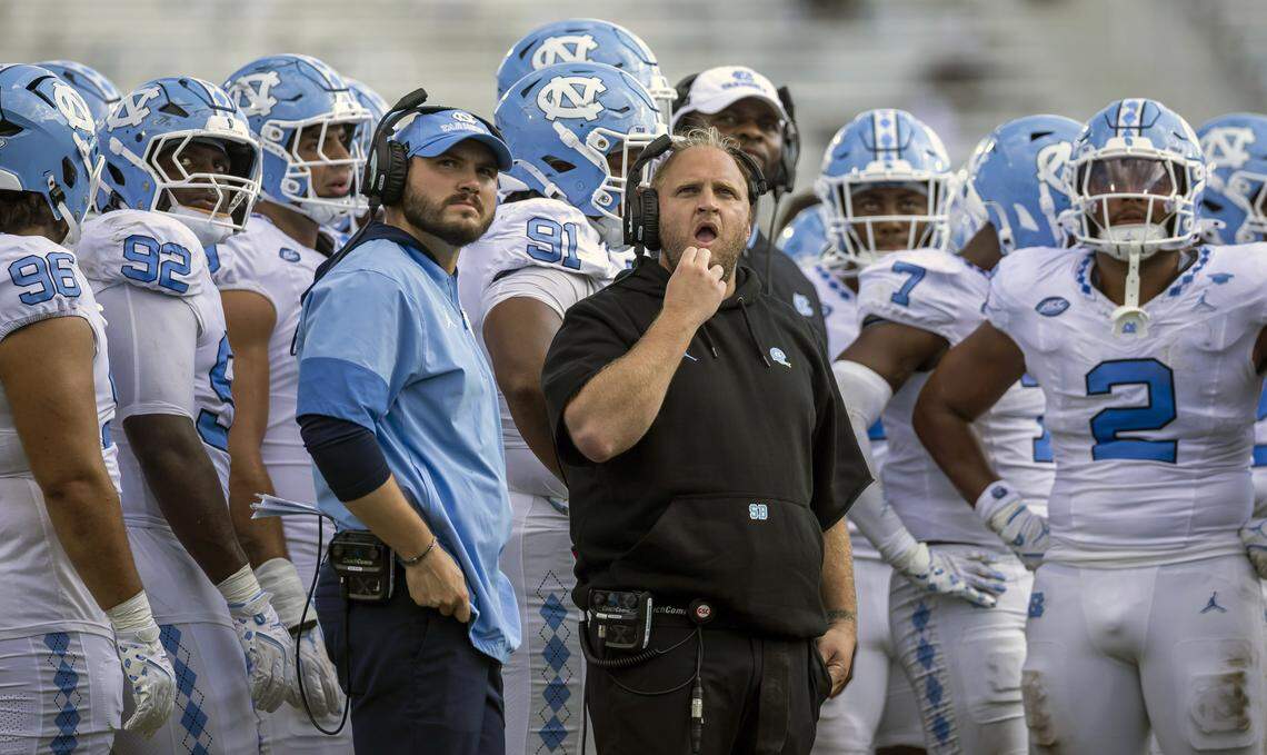 Down 13-0 in the second quarter to the University of Central Florida, North Carolina defensive coordinator Steve Belichick studies a replay on the scoreboard during a time-out on Saturday, September 20, 2025 at Acrisure Bounce House Stadium in Orlando, Fla.