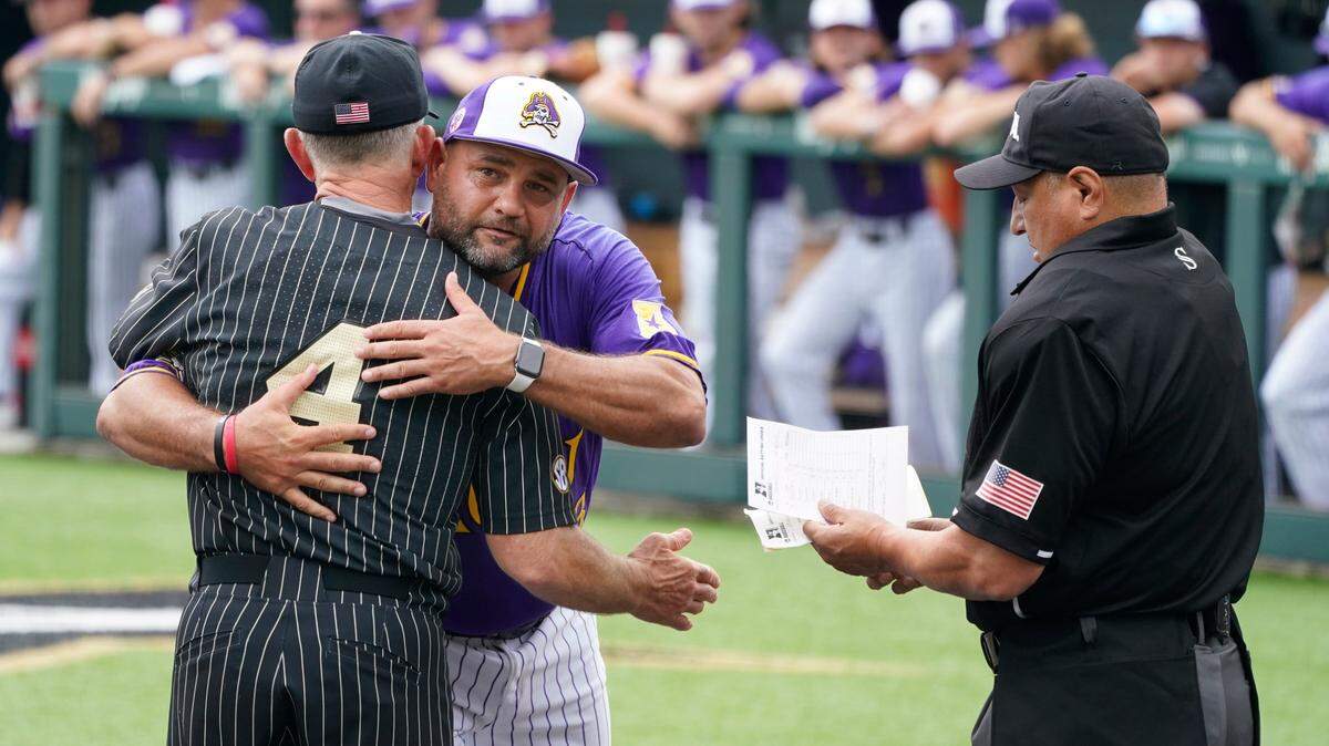Vanderbilt head coach Tim Corbin (4) hugs East Carolina head coach Cliff Godwin before an NCAA college baseball super regional game Friday, June 11, 2021, in Nashville.