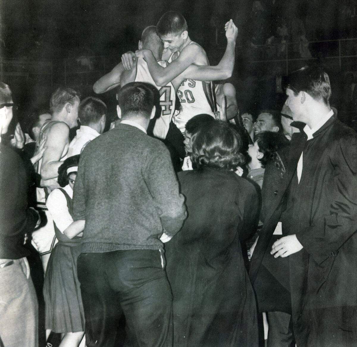 Pete Maravich (20) and Broughton teammates are carried off the court after a Broughton win in 1965. The team had a 9-14 record and missed the state playoffs.
