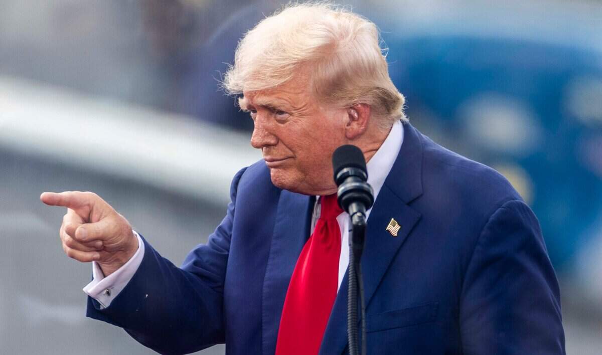 Former President Donald Trump acknowledges supporters during a rally at the North Carolina Aviation Museum & Hall of Fame in Asheboro, NC on Wednesday, Aug. 21, 2024.