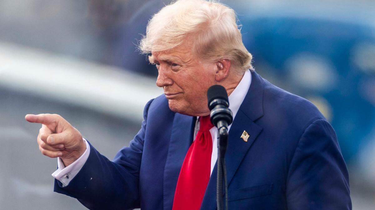 Former President Donald Trump acknowledges supporters during a rally at the North Carolina Aviation Museum & Hall of Fame in Asheboro, NC on Wednesday, Aug. 21, 2024.