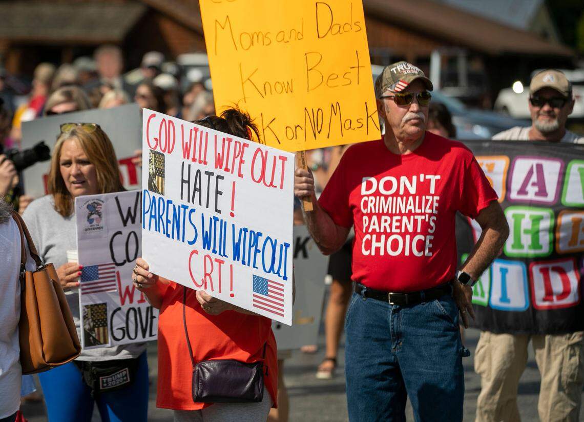Demonstrators line up to march to the Johnston County School Board meeting to voice their opposition to a mask mandate and the teaching of critical race theory on Tuesday, September 14, 2021 in Smithfield, N.C.
