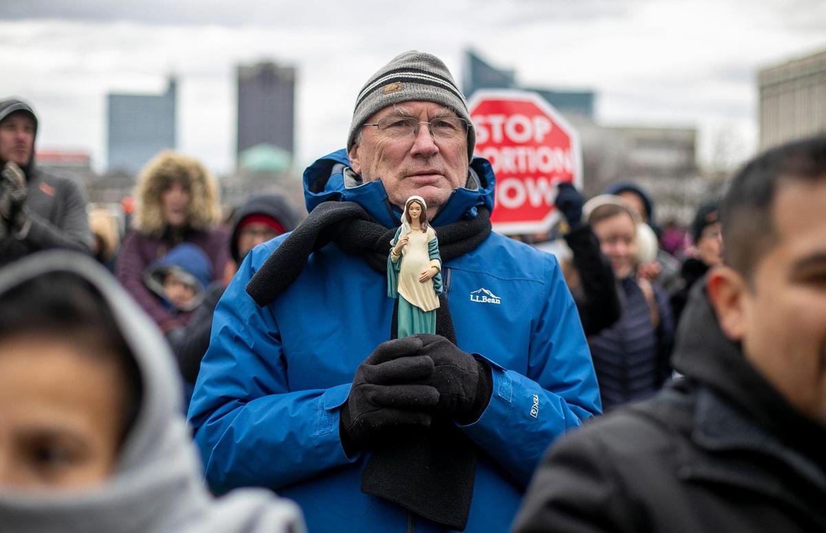 Ken Sweet of Raleigh clutches a statue of the Virgin Mary as he listens to Lt. Governor Mark Robinson during the North Carolina Right to Life Rally on Saturday, January 14, 2023 in Raleigh, N.C.