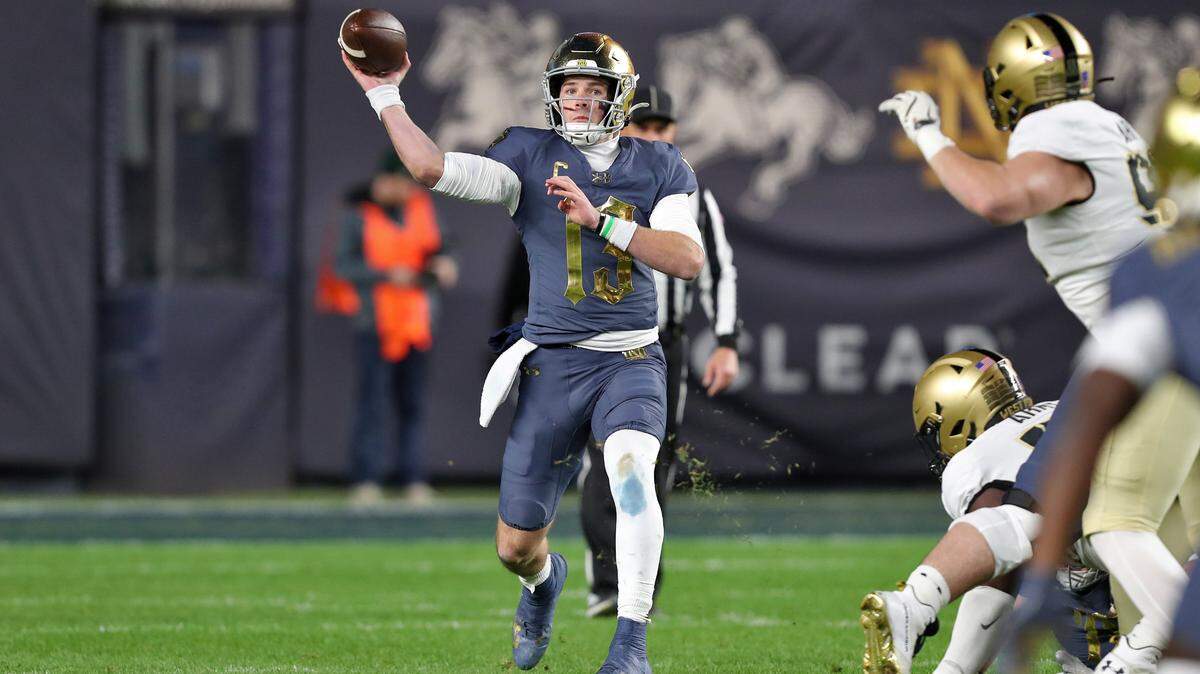 Notre Dame Fighting Irish quarterback Riley Leonard (13) throws a pass against the Army Black Knights during the first half at Yankee Stadium.