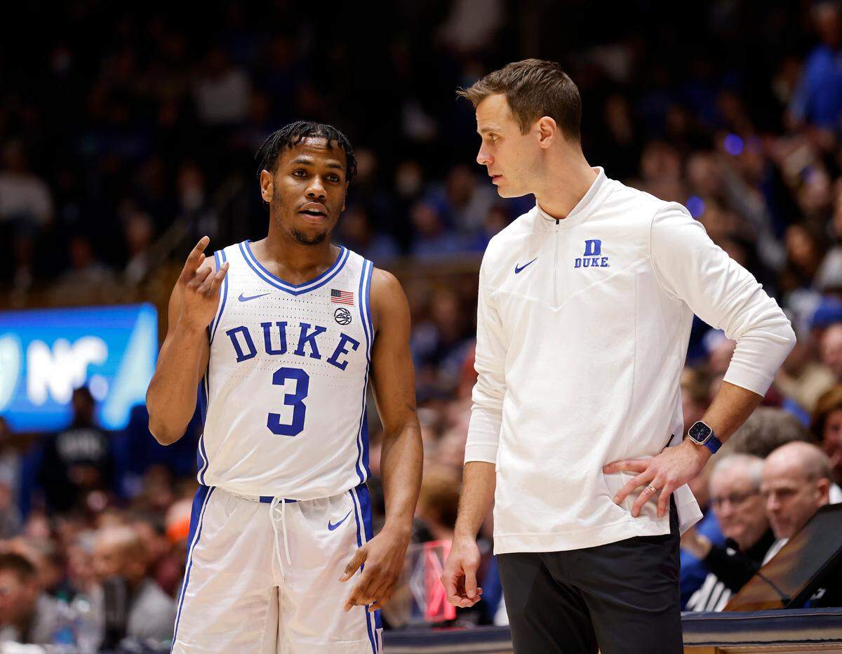 Duke’s Jeremy Roach talks with head coach Jon Scheyer during the second half of the Blue Devils’ 81-65 win over Virginia Tech on Saturday, Feb. 25, 2023, at Cameron Indoor Stadium in Durham, N.C.