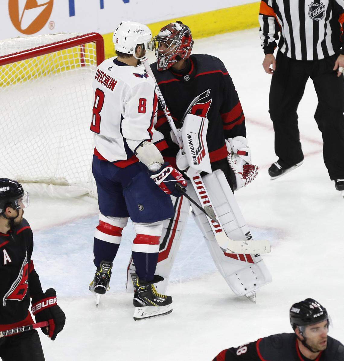 Carolina goalie Petr Mrazek (34) has words with Washington’s Alex Ovechkin (8) during the third period of the Carolina Hurricanes’ 5-0 victory over the Washington Capitals at PNC Arena in Raleigh, N.C., Monday, April 15, 2019.