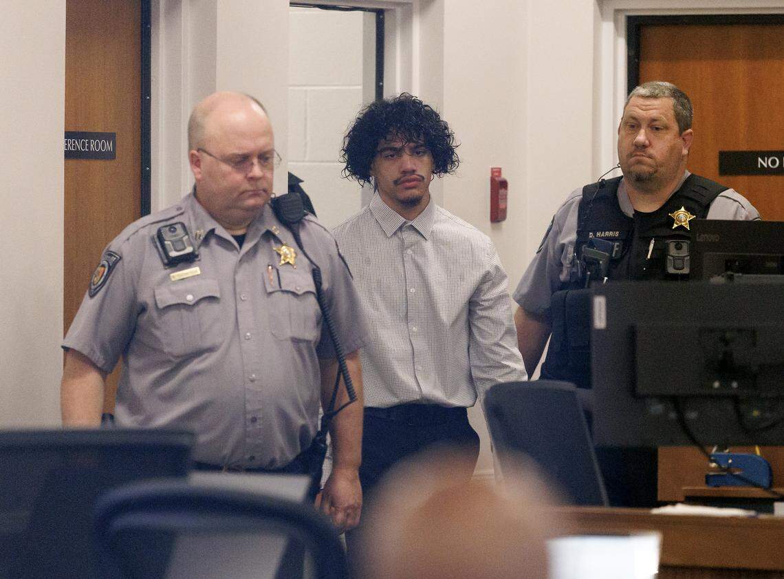 Issiah Ross, center, who is accused of fatally shooting two teenagers in Orange County in 2022, enters a courtroom at the Orange County Courthouse on Monday, Jan. 12, 2026, in Hillsborough, N.C. Ross’ attorney said in court Monday that he will argue it was self-defense when the jury trial starts later this week.