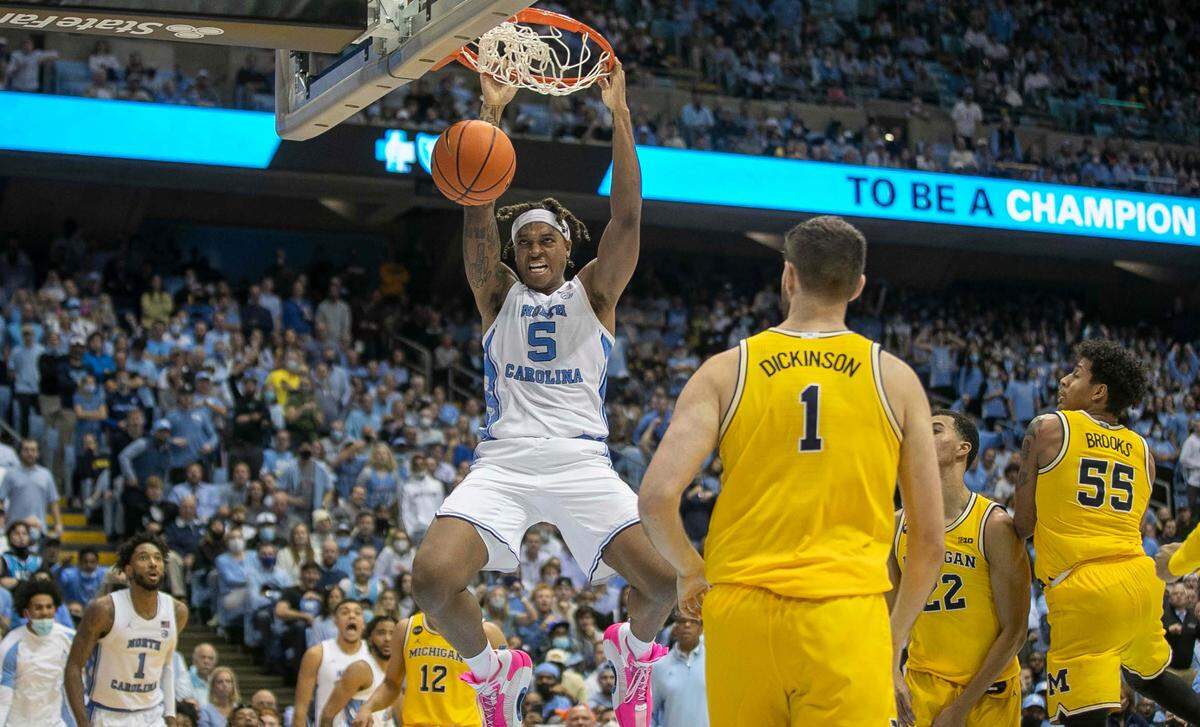North Carolina’s Armando Bacot (5) gets a dunk during the second half against Michigan on Wednesday, December 1, 2021 at the Smith Center in Chapel Hill, N.C. Bacot scored 11 points in the Tar Heels’ 72-51 victory.