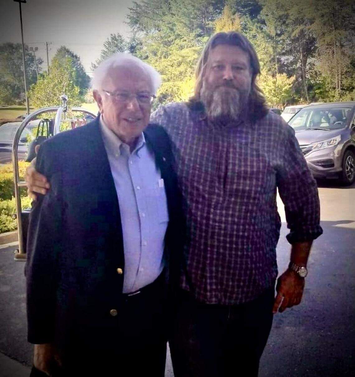 Nick Watson poses with Democratic presidential contender Bernie Sanders at the Sheraton in Chapel Hill in 2019.