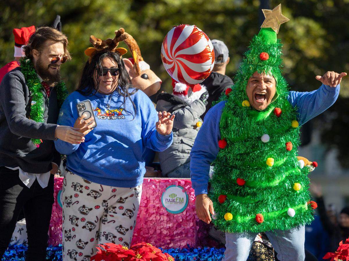 The festive Curtis Media Group float during the 80th annual Raleigh Christmas Parade on Saturday, November 23, 2024 in Raleigh, N.C. 