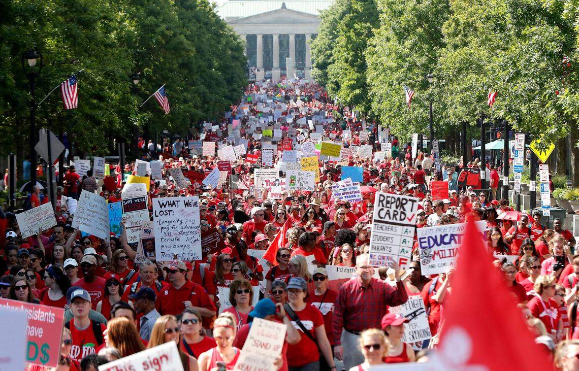 Thousands of teachers, other school employees and their supporters marched up Fayetteville Street through downtown Raleigh during a “Day of Action” organized by the N.C. Association of Educators Wednesday, May 1, 2019.