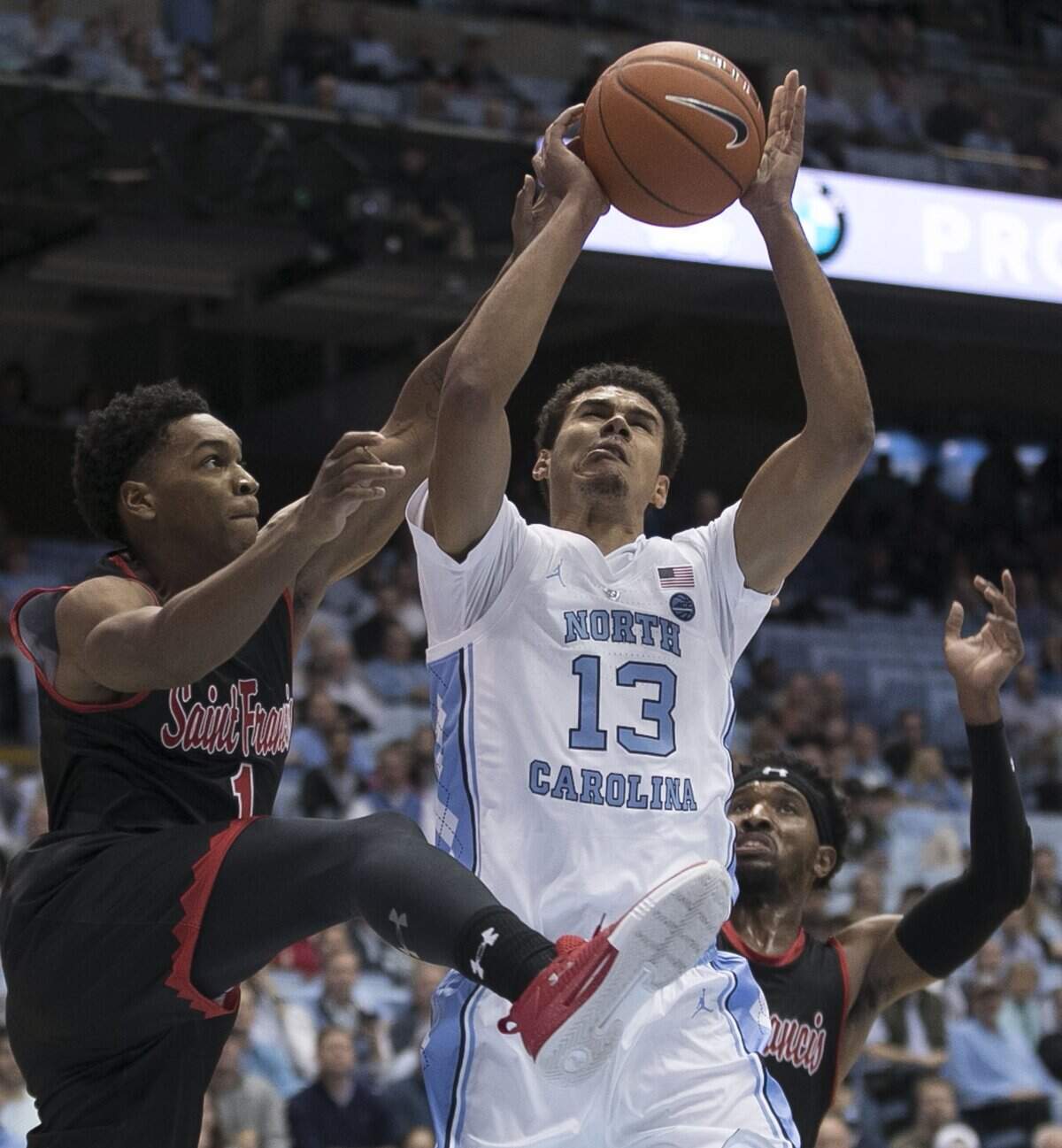 North Carolina’s Cameron Johnson (13) puts up a shot against St. Francis’ Ramir Dixon-Conover (1) during the first half on Monday, November 19, 2018 at the Smith Center in Chapel Hill, N.C. Johnson scored 11 points in the first half.