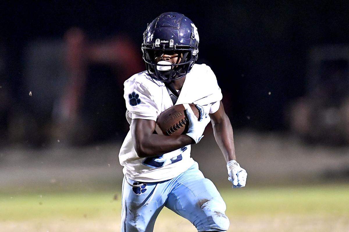 Millbrook running back Santonis Wright (23) runs for the first down against Rolesville during the second half. The Millbrook Wildcats and the Rolesville Rams met in a conference football game in Rolesville, N.C. September 26, 2025