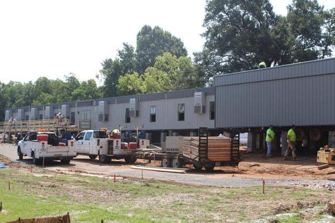 Progress has been slower than expected on the new Exploris Elementary School off New Bern Avenue, forcing the school to delay opening until Sept. 22.