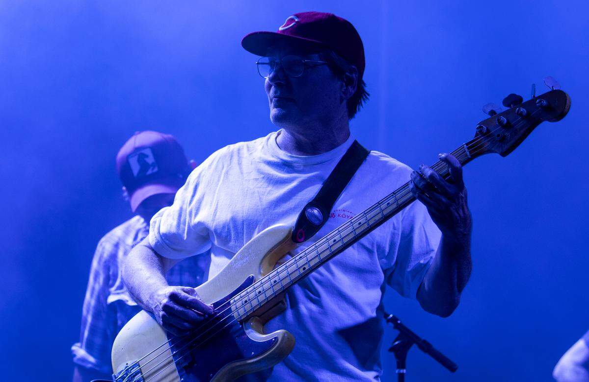 Pavement bassist Mark Ibold is bathed in blue light during their performance at the Hopscotch Music Festival, Thursday night, Sept. 7, 2023 in downtown Raleigh, N.C..