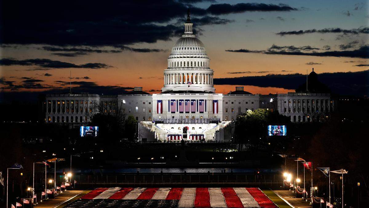 Capitol Building and stage for the swearing-in is lit as events get underway for President-elect Joe Biden’s inauguration ceremony, Wednesday, Jan. 20, 2021, in Washington.