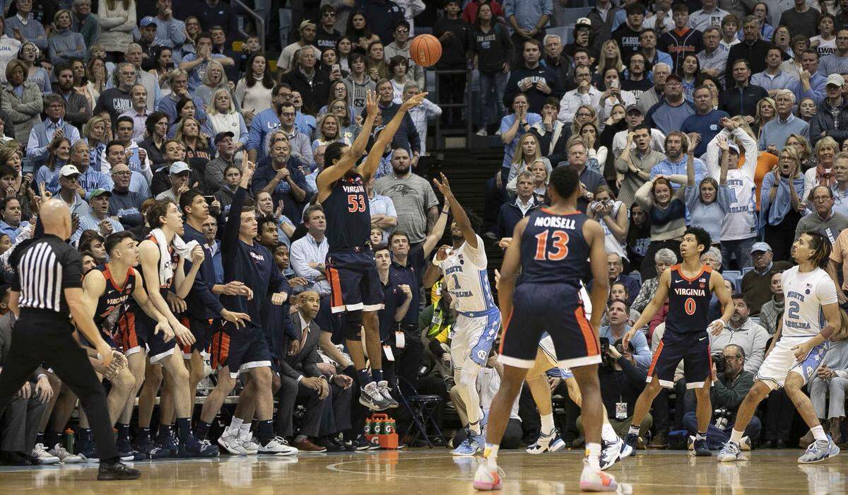 Virginia’s Tomas Woldetensae (53) launches the game winning shot with less than a second to play to give Virginia a 64-62 victory over North Carolina on Saturday, February 15, 2020 at the Smith Center in Chapel Hill, N.C.