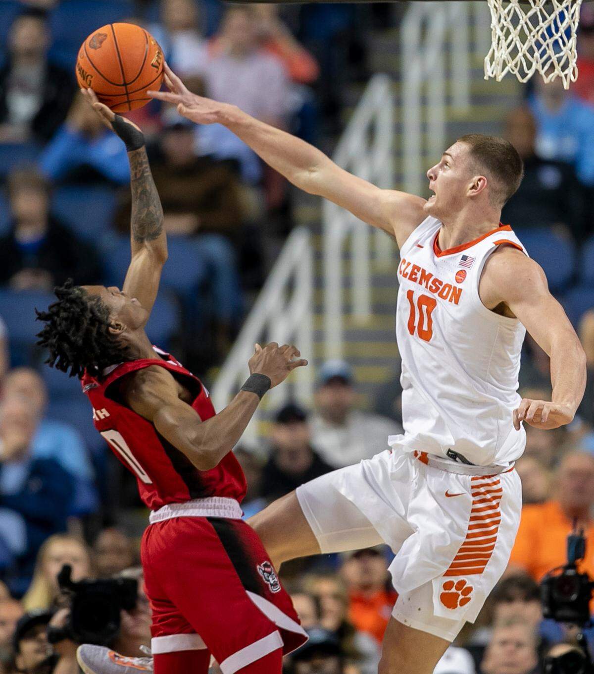 Clemson’s Ben Middlebrooks (10) blocks a shot by N.C. State’s Terquavion Smith (0) in the second half during the third round of the ACC Tournament on Thursday, March 9, 2023 at the Greensboro Coliseum in Greensboro, N.C.