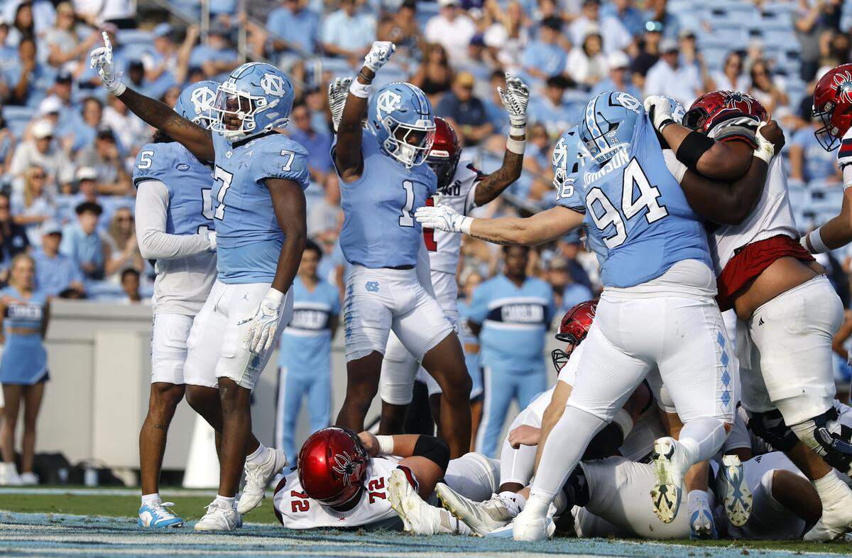 North Carolina linebacker Khmori House (7) and the defense celebrate after stopping Richmond on fourth and goal during the second half of UNC’s 41-6 victory over Richmond at Kenan Stadium in Chapel Hill, N.C., Saturday, Sept. 13, 2025.