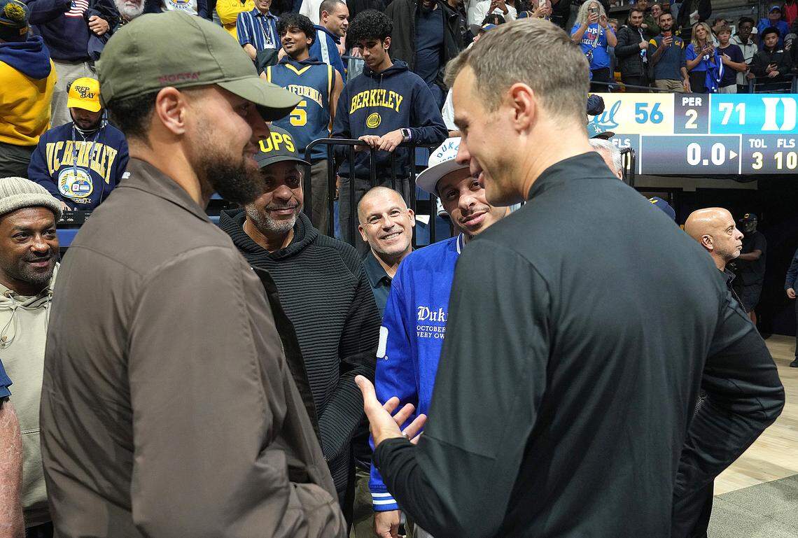 Stephen Curry, Dell Curry, Seth Curry and Duke head coach Jon Scheyer talk after the Blue Devils defeated the California Golden Bears 71-56 at Haas Pavilion on January 14, 2026 in Berkeley, California. 