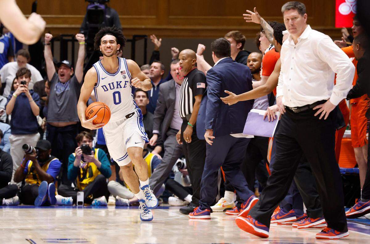 Duke’s Jared McCain (0) heads back downcourt as time expires during in the Blue Devils’ 72-71 victory over Clemson at Cameron Indoor Stadium in Durham, N.C., Saturday, Jan. 27, 2024. Official Lamar Simpson stands in the center and Clemson head coach Brad Brownell is to the right.