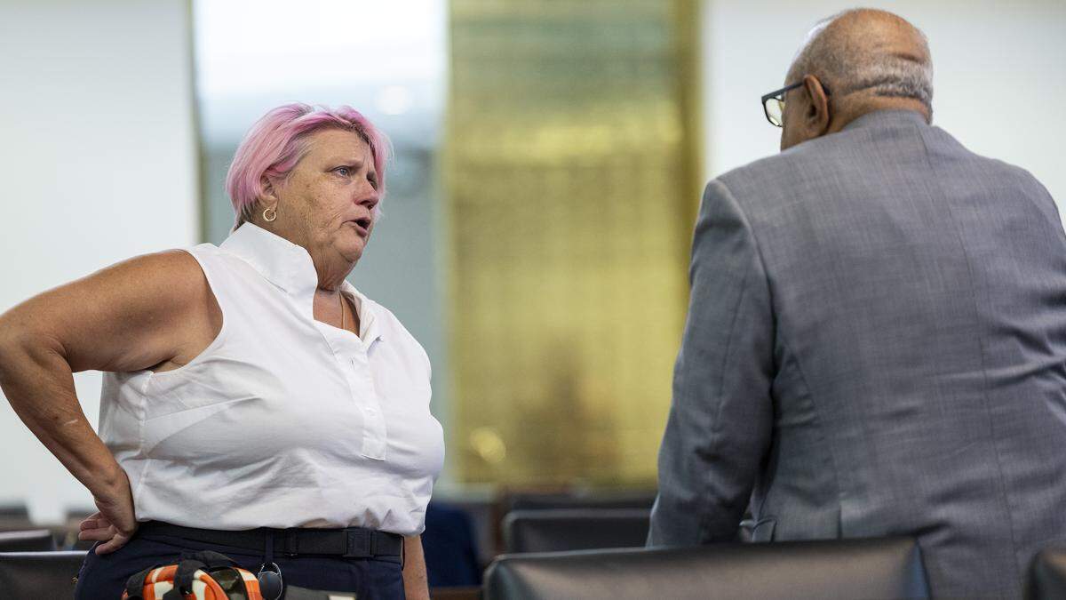 Rep. Allison Dahle of Raleigh, an LGBTQ lawmaker, left, speaks with Rep. Nasif Majeed, a Democrat from Mecklenburg County, after he voted with Republicans to override Gov. Josh Stein’s veto of a controversial bill addressing sexuality, religion in schools, and school libraries—a win for Senate and House Republicans—on Tuesday, July 29, 2025, at the General Assembly.